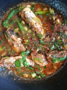 Hot stir fried mackerel in tomato sauce